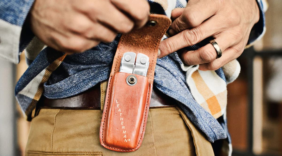 A Leatherman tool carried in a hand-made leather sheath